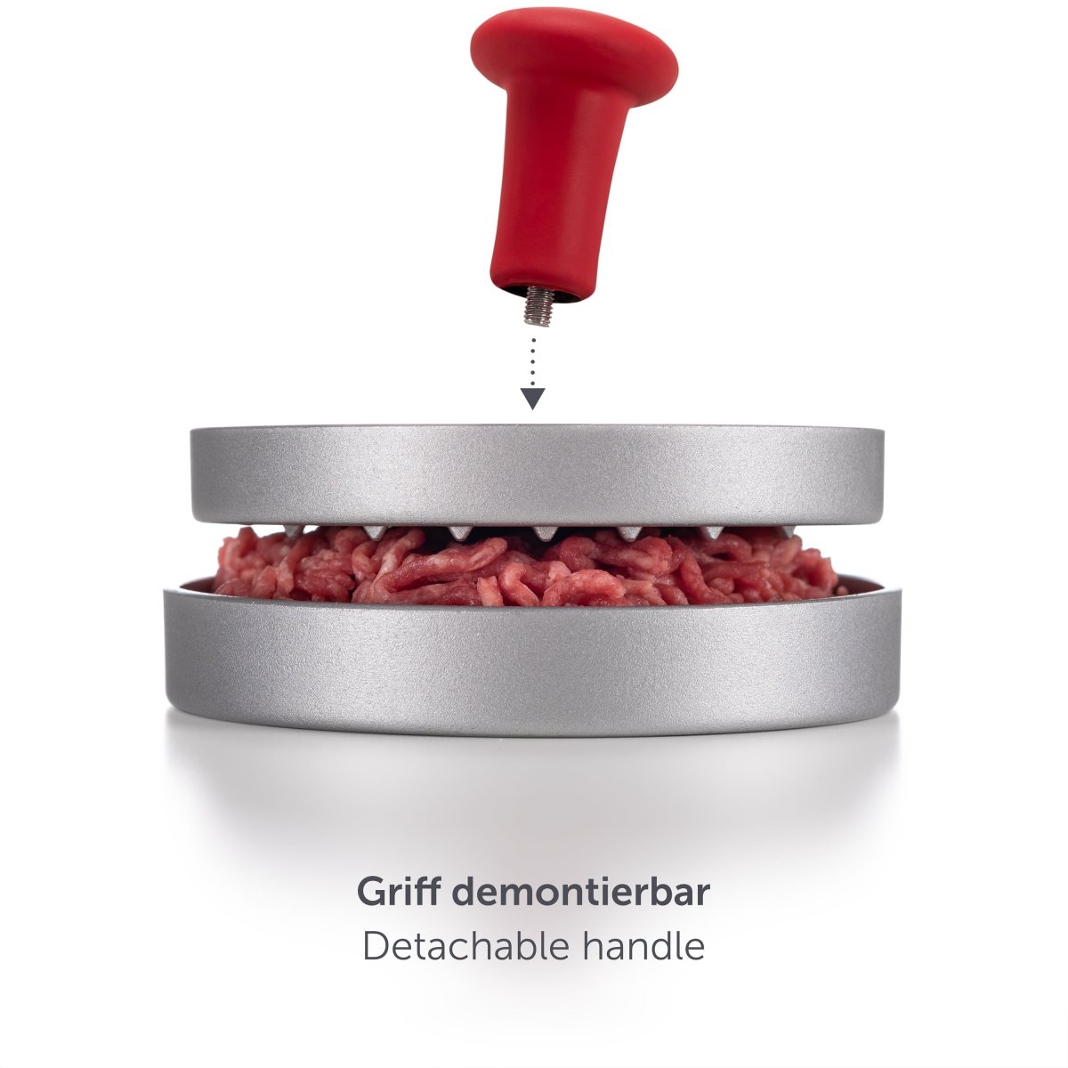 Burgerpresse in Aktion mit Hackfleischfüllung und demontierbarem Griff.