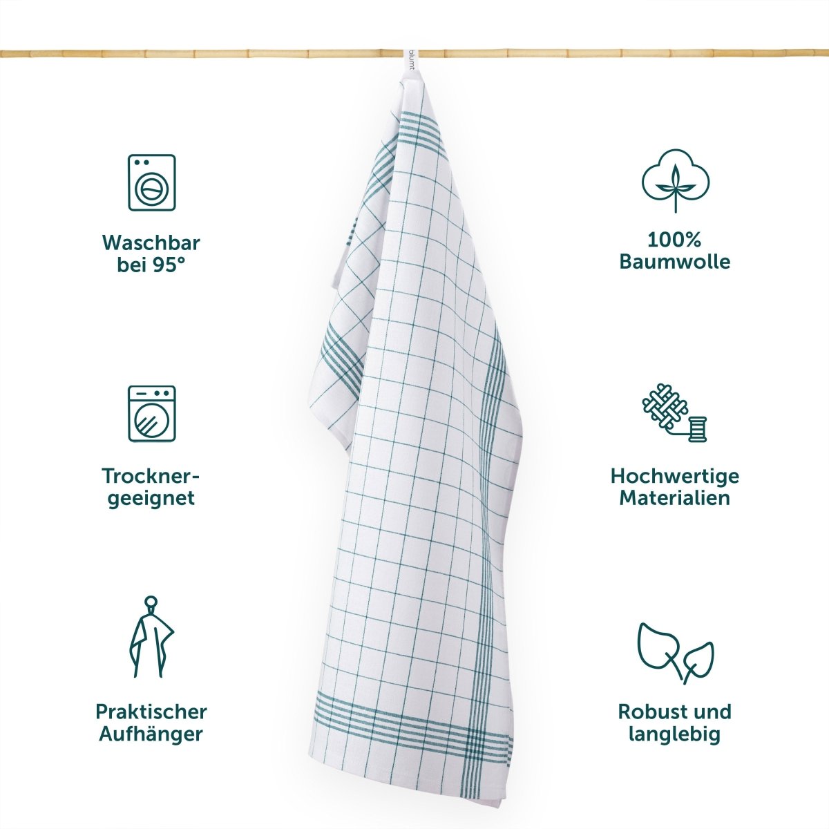 Geschirrtuch hängt an einer Leiste mit Symbolen für Waschbarkeit Materialqualität und praktischen Eigenschaften.