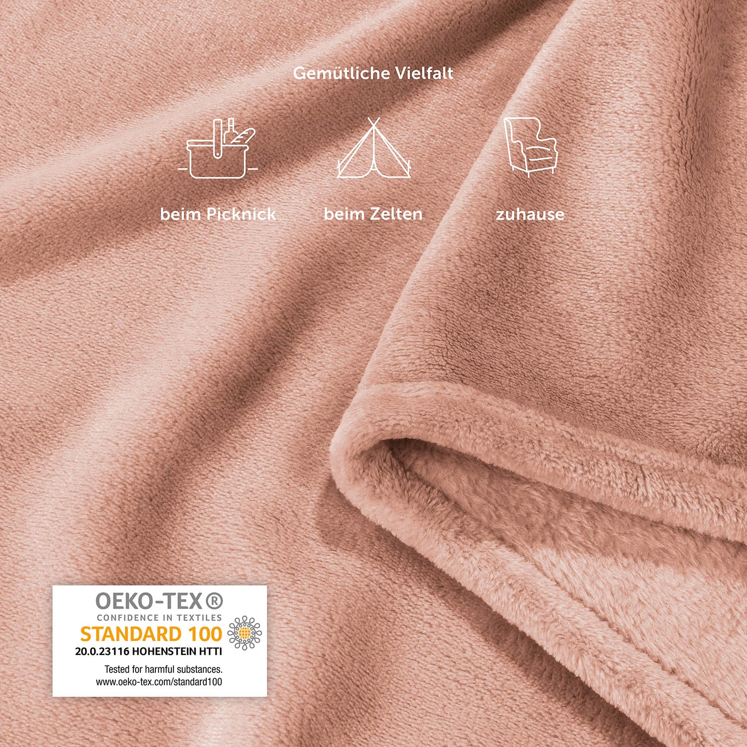 Detailansicht der rosafarbenen Fleece-Kuscheldecke mit Piktogrammen, die vielfältige Einsatzmöglichkeiten wie beim Picknick, Zelten und zu Hause zeigen, inklusive OEKO-TEX Standard 100 Siegel.