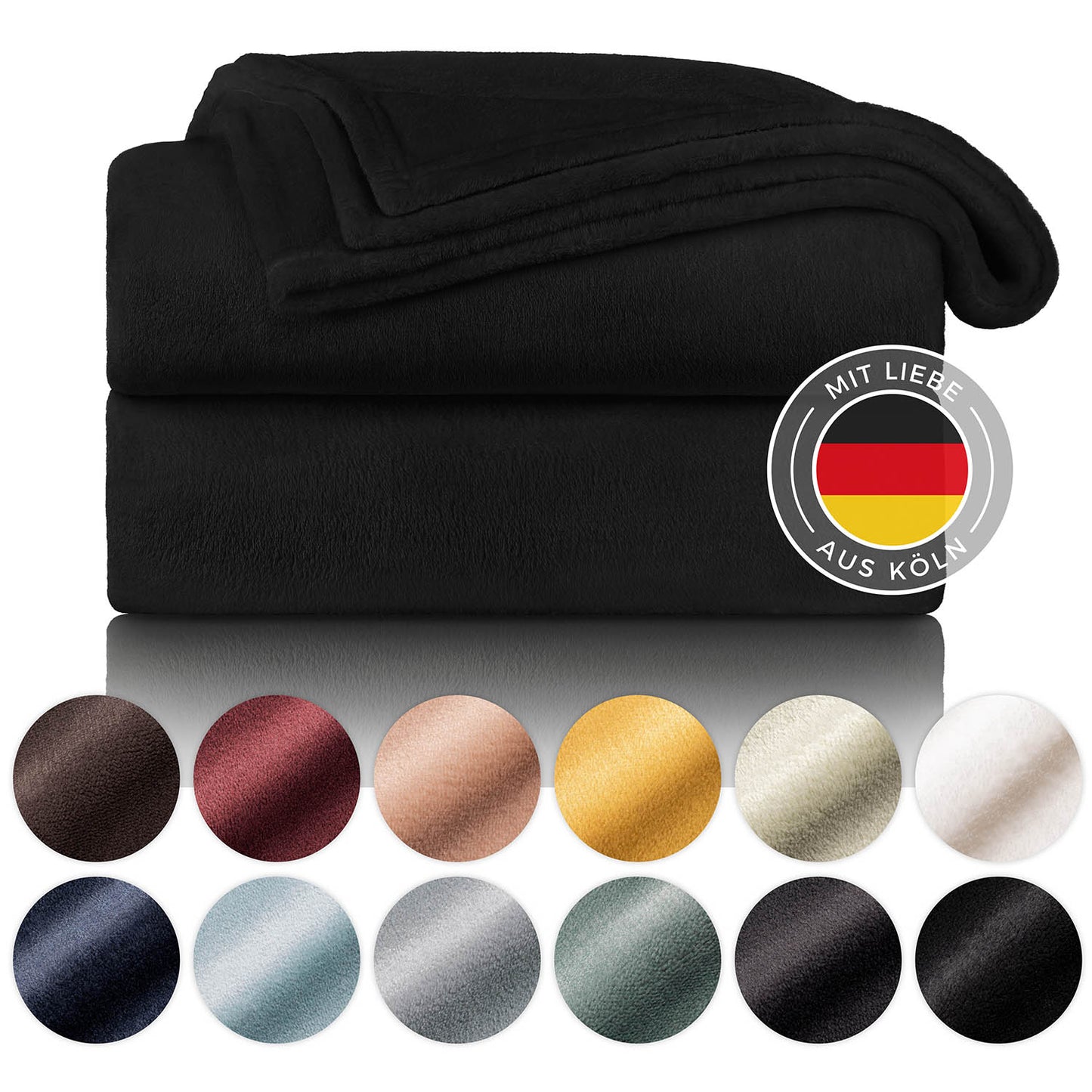 Schwarze Fleece-Kuscheldecke, gefaltet und präsentiert neben einer Farbpalette mit verschiedenen Farboptionen und einem Label, das 'Mit Liebe aus Köln' sagt.