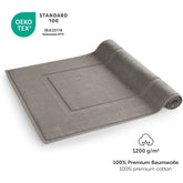 Graues Handtuch mit OEKO-TEX Label und Grammaturangabe.