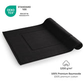 Schwarzes Handtuch mit OEKO-TEX Label und Grammaturangabe.