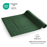 Gruenes Handtuch mit OEKO-TEX Label und Grammaturangabe.