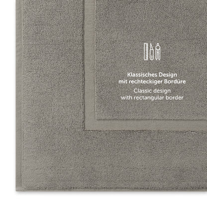 Graues Handtuch mit klassischem Design und Bordürendetail.