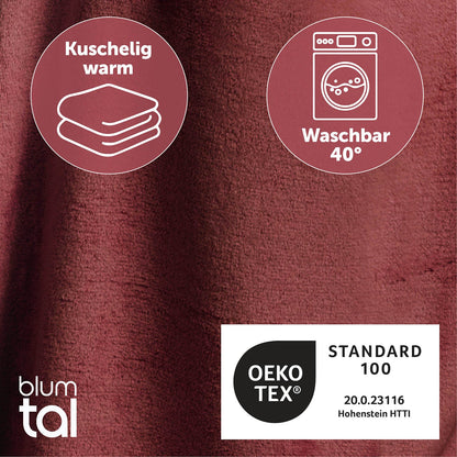 Detailansicht des dunkelroten flauschigen Stoffes mit Symbolen für Kuschelwärme und Waschbarkeit bei 40 Grad sowie OEKO-TEX Standard 100 Zertifizierung.