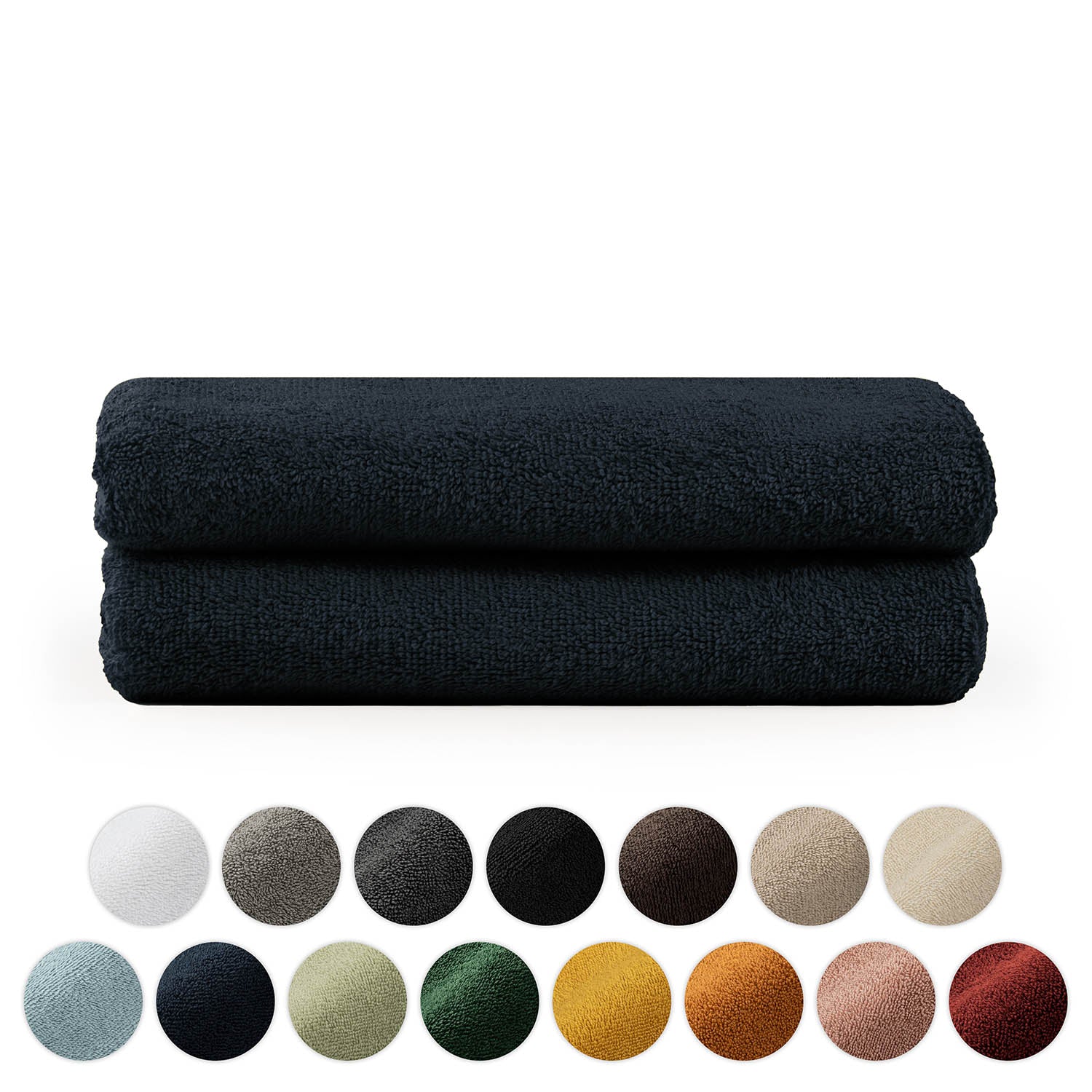 Stapel von zwei gefalteten Handtüchern mit einer Palette verschiedener Farbkreise darunter in Weiß Grau Schwarz Brauntönen Blau Grün Gelb und Rot